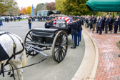These caissons were built in 1918, and used for 75mm cannons. They were originally equipped with ammunition chests, spare wheels, and tools used for the cannons. Today these have been removed and replaced with the flat deck on which the casket rests.