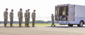 Transfer vehicle guide Senior Airman Kristina C. Barr closes the doors to transfer vehicle.
