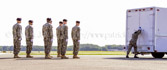 Transfer vehicle guide Senior Airman Kristina C. Barr closes the doors to transfer vehicle.