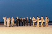 Dignified transfer officer orders “Present, Arms” (slow movement salute)