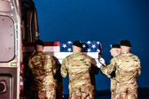 Carry team moves transfer case into the mortuary transfer vehicle<br /><br />Dignified transfer officer orders “Order, Arms” (slow movement salute)