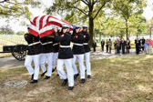 Marine body bears team placing remains of Tarawa 2nd Lt George S. Bussa (Silver Star) at Section 60 gravesite.