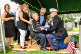 Captain Culp presented the flag to Victor Ragucci while brother Dominic looked on.