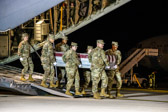 Carry team carries transfer case of Seaman Apprentice Cameron S. Walters to the mortuary transfer vehicle