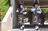 The Ocean County New Jersey Emerald Society Pipes & Drums leads the Gold Star Mothers into the memorial
