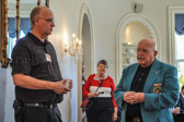 Barry Newstadt, on right from the Commission of Veteran Affairs DE going over issues with a guest