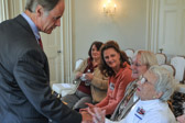 Sen. Tom Carper greeting the Gold Star Family members