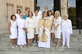 After services the Rev. Canon Jan Naylor Cope, vicar of Washington National Cathedral poses with some of the Gold Star Mothers.