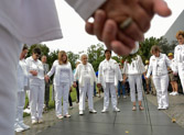 Gold Star Mothers Chaplain Ann Davis leads everyone in prayer.