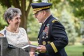 National President Candy Martin presents General Mark A. Milley with the AGSM History book.