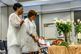 Gold Star Mothers Mona Gunn and Karen Meredith place there roses.