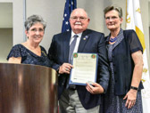 Candy Martin, PNP presented a resolution for Wreaths Across America, accepting Wayne Hanson along with his wife Ann.