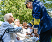 Admiral Karl L. Schultz, 26th Commandant of the Coast Guard expresses greeting to Gold Star Mother Emogene Cupp