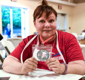 Gold Star Mother Sandra Aceves holding image of her Son, U.S. Navy Corpsman Fernando “Doc” Mendez