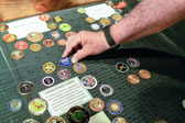 Vietnam Veteran Wayne Hanson places a challenge coin for Wreaths Across America,  Chairman of the Board of Trustees