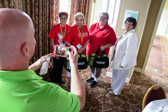 Gary Parisher, Cheeriodicals CEO takes photo of some the Moms with their finished duffel bags for the Vets.