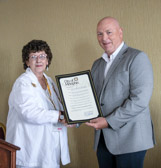 A proclamation from the Mayor of Memphis, Jim Strickland is presented to Cindy Tatum, National President of the American Gold Star Mothers