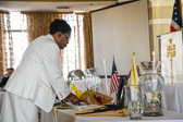 A floral tribute to the fallen is placed by PNP Mona Gunn (on behalf of PNP Georgie Carter-Krell)