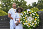 LT Taylor with Gold Star Mom Sandra C. Johnson, holding picture of her only son Marine PFC. Michael Anthony Cater, Jr.