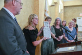 Gold Star Mothers National President Sarah Taylor shows off Never Forget Garden plaque received from the Society of the Honor Guard, Tomb of the Unknown Soldier