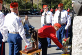 Names of the fallen Marines were read, then a tolling of the bell and placing of flowers for each.