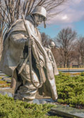 They are approximately 7’3" tall, heroic scale and consist of 14 Army, 3 Marines, 1 Navy Corpsman, and 1 Air Force. They represent an ethnic cross section of America with 12 Caucasian, 3 African American, 2 Hispanic, 1 Oriental, 1 Indian (Native American).