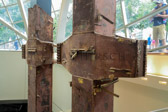 The pillars are side-by-side within the glass entrance pavilion at the National September 911 Memorial & Museum.