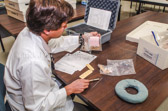 A typical recovery team is made up of ten to 14 people, led by a team leader and a forensic anthropologist. The team leader is responsible for the overall safety and success of the mission, while the civilian anthropologist directs the excavation of the site much like a detective oversees a crime scene. Other members of the team typically include a team sergeant, linguist, medic, life support technician, forensic photographer, and an explosive ordnance disposal technician.