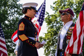 Before services began the newly appointed, Angela M. Maness first female Sergeant Major of Marine Barracks Washington, DC greets some of the Patriot Guard riders standing guard.