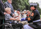 Marine Corps Sergeant Major Angela M. Maness presents our national colors to the family of  PFC Jonathan Reed Posey, Jr.