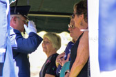A second folded Flag is presented to the surviving family members.