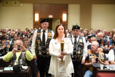 Gold Star Mother Brenda Shelton, proud Mother of Air Force Senior Airman Benjamin D. White KIA Afghanistan on June 9, 2010, holding the 'Flame of Freedom'.