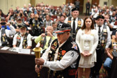 Bob Penn,  Chapter 6 NC takes the 'Flame of Freedom' over to the “Missing Man” table to light the candle.