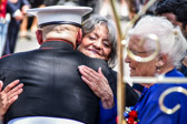 Mom gives her proud son, the Saluting Marine Staff Sergeant Tim Chambers a big hug.