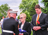 The American flag is presented to Dorothy Barnes