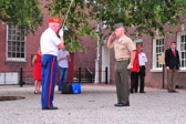 Sgt-At-Arms Dick Mansfield rendering a salute to Col. John C. Church, Jr.