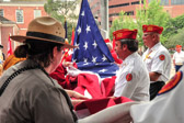 National Park Ranger assists in raising the flag that normally fly's at Independence Hall.