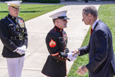 Retired Marine Corps General and the 16th Chairman of the Joint Chiefs of Staff Peter Pace congratulates Cpl. William “Kyle” Carpenter