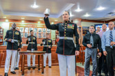 Sergeant Major Angela M. Maness proposes a toast to  Medal of Honor recipient Cpl. William “Kyle” Carpenter