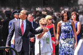 President Obama can hear the incoming fly over plane.