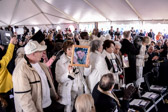 The Gold Star Families were asked to stand and proudly show off photographs of their loved ones.